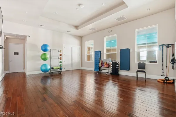 a view of livingroom with hardwood floor and furniture