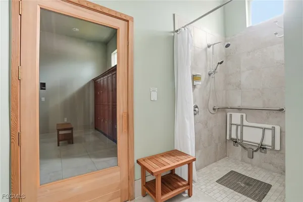 a bathroom with a shower and a toilet