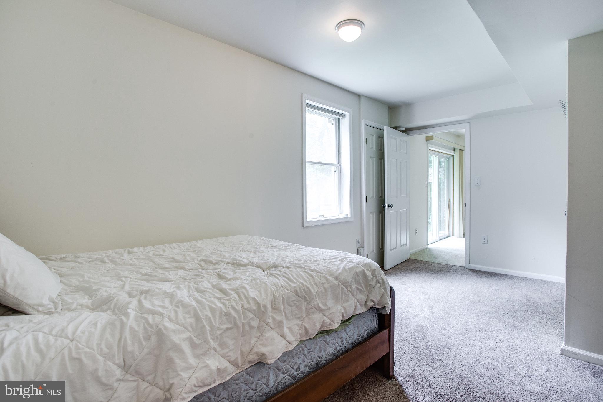 6311 Hunting Ridge Lane McLean, VA 22101 - Photo 35 of 44 Lower lvl bedroom w/ window and attached bathroom