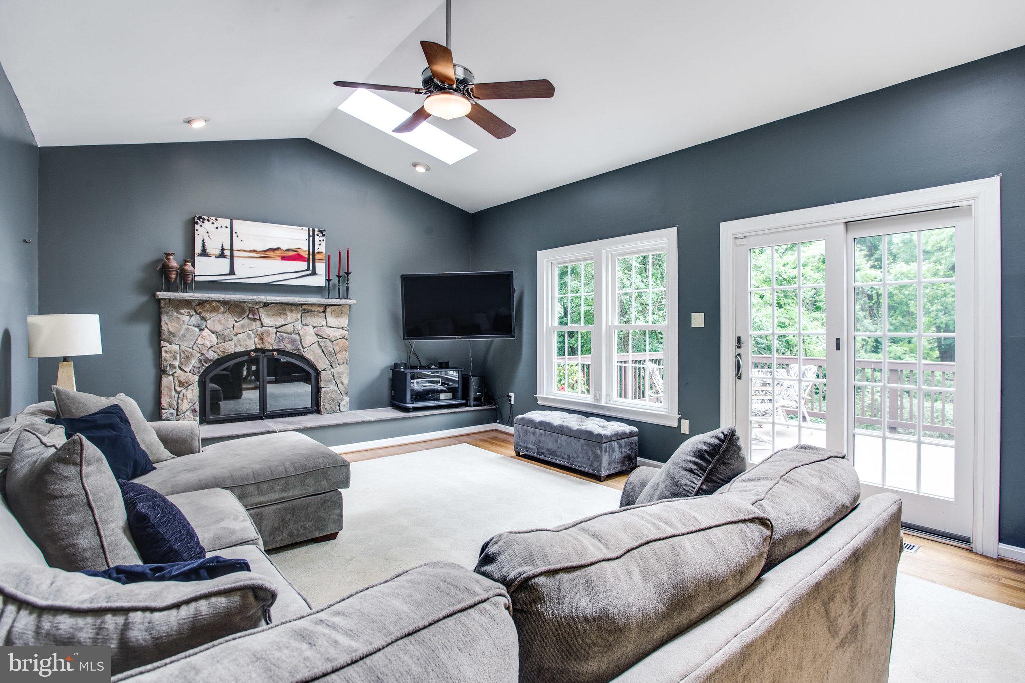 6311 Hunting Ridge Lane McLean, VA 22101 - Photo 4 of 44 Enjoy the family room's wood burning fireplace.