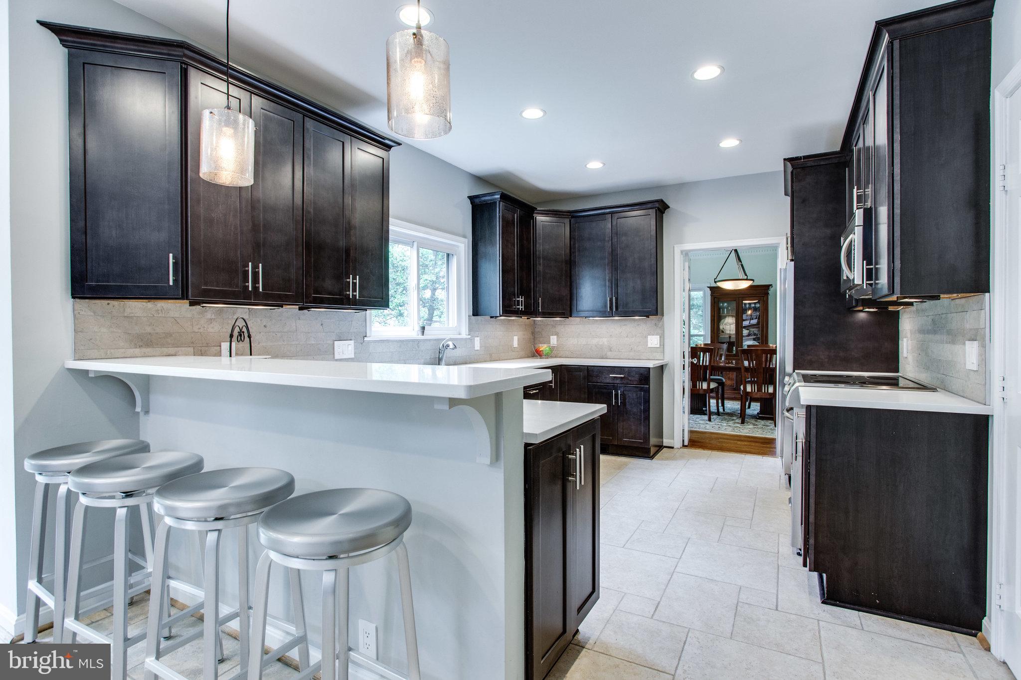 6311 Hunting Ridge Lane McLean, VA 22101 - Photo 9 of 44 Modern breakfast bar seats plenty