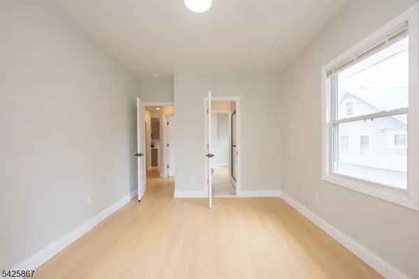 a view of empty room with a fireplace