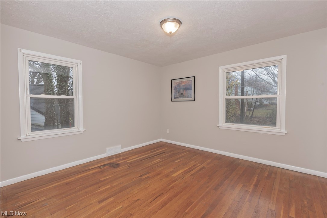 4402 Bayard Road South Euclid, OH 44121 - Photo 14 of 27 1st floor Owners bedroom with hardwood floors