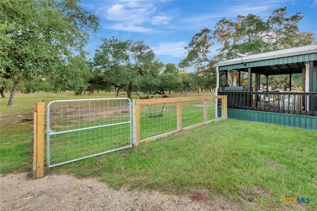 a balcony with furniture and large windows
