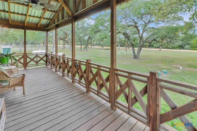 a view of a house with a yard and porch