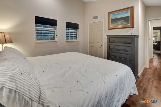 a bathroom with a granite countertop toilet a sink and a bathtub