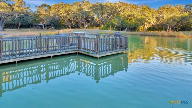 a view of a deck with hardwood and lake view