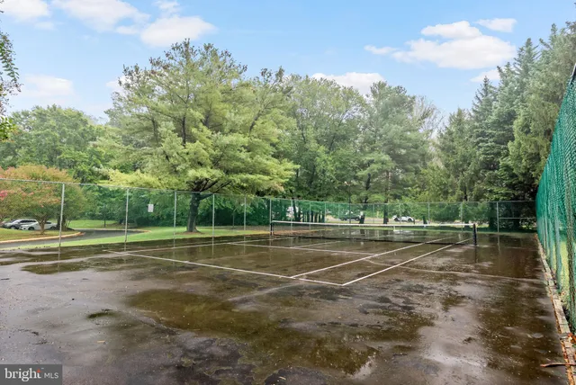 a view of an outdoor space and tennis court