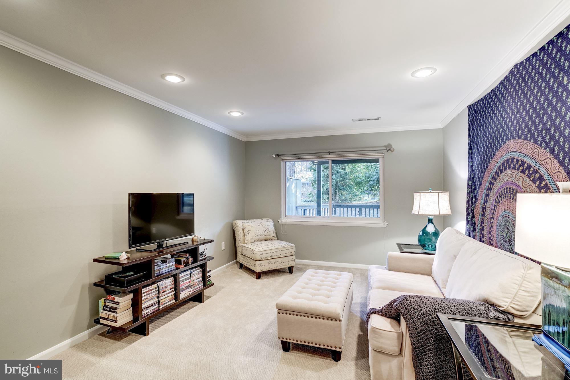 2035 Golf Course Drive Reston, VA 20191 - Photo 19 of 28 a living room with furniture and a flat screen tv