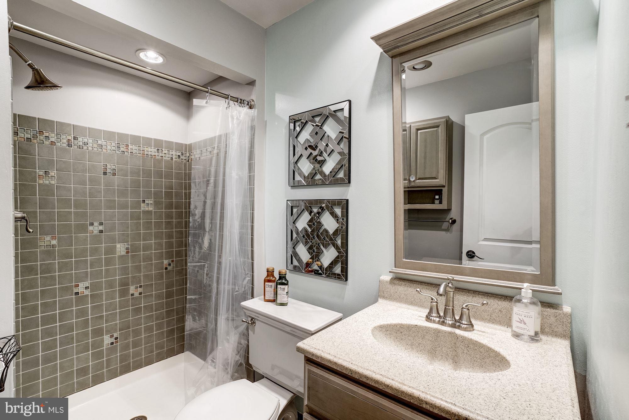 2035 Golf Course Drive Reston, VA 20191 - Photo 20 of 28 a bathroom with a sink toilet and shower
