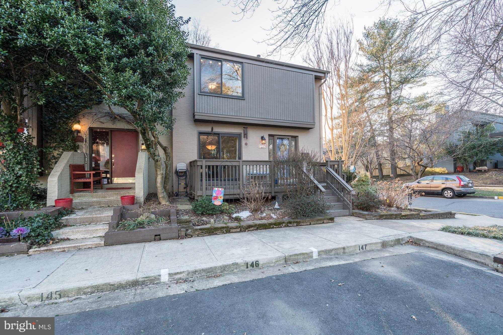 2035 Golf Course Drive Reston, VA 20191 - Photo 3 of 28 a front view of a house with a yard and garage