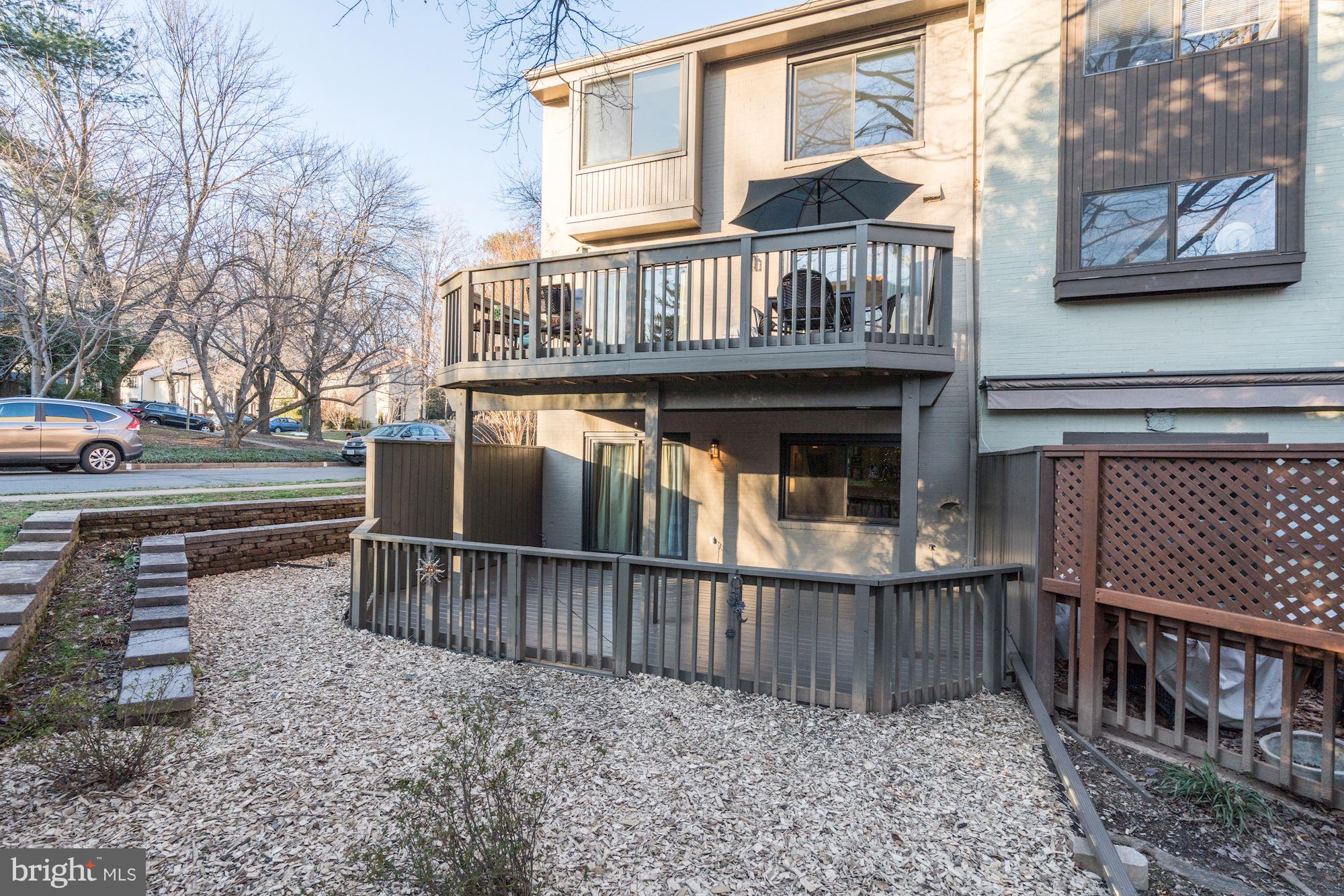 2035 Golf Course Drive Reston, VA 20191 - Photo 26 of 28 a view of a house with wooden deck front of house