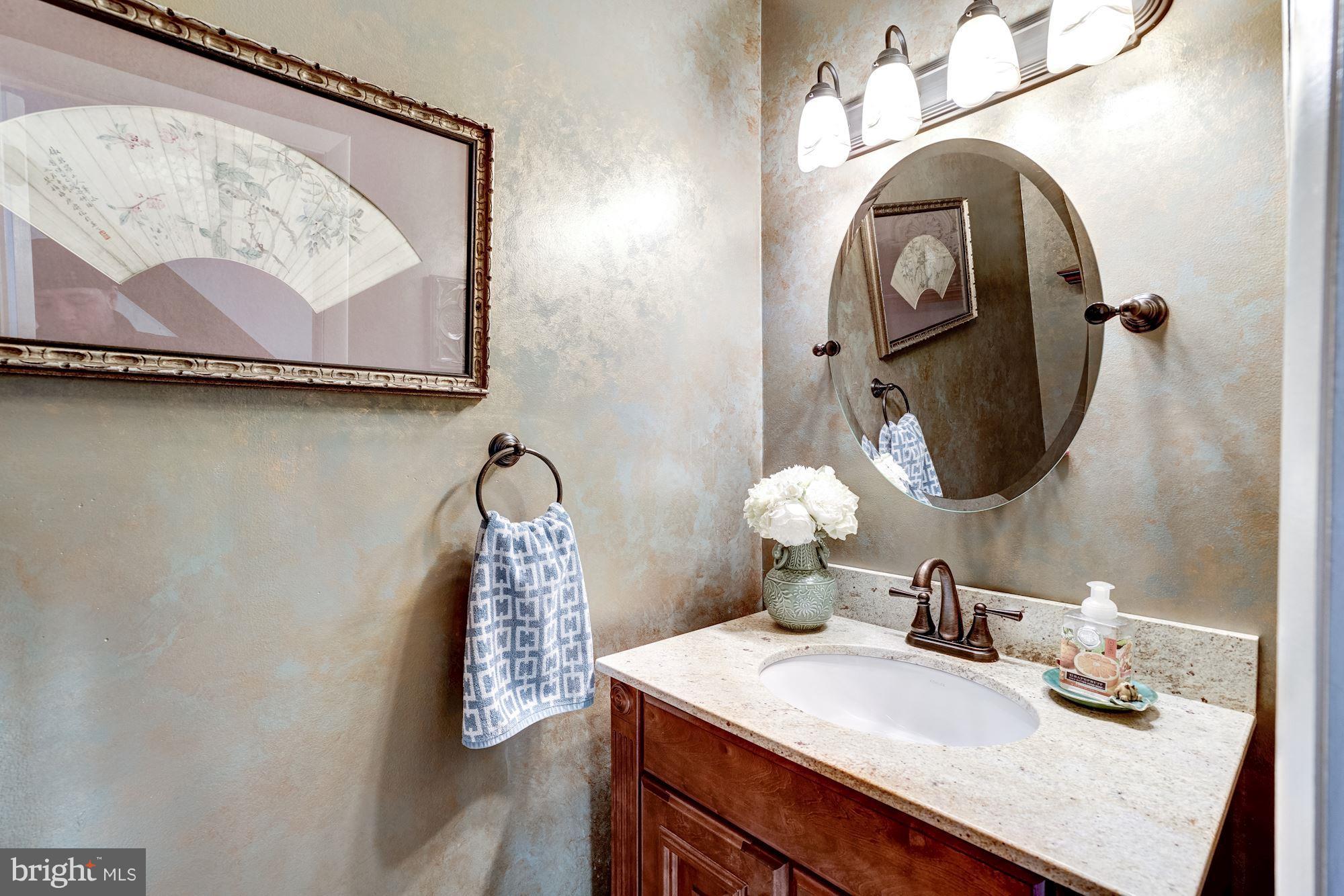 2035 Golf Course Drive Reston, VA 20191 - Photo 6 of 28 a bathroom with a sink and mirror