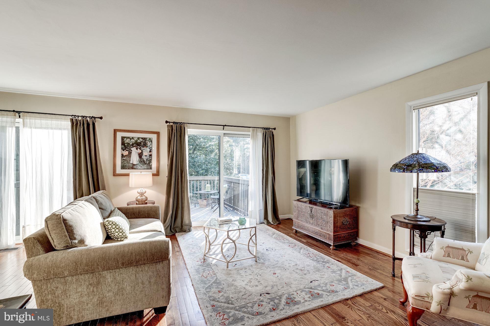 2035 Golf Course Drive Reston, VA 20191 - Photo 7 of 28 a living room with furniture and a flat screen tv