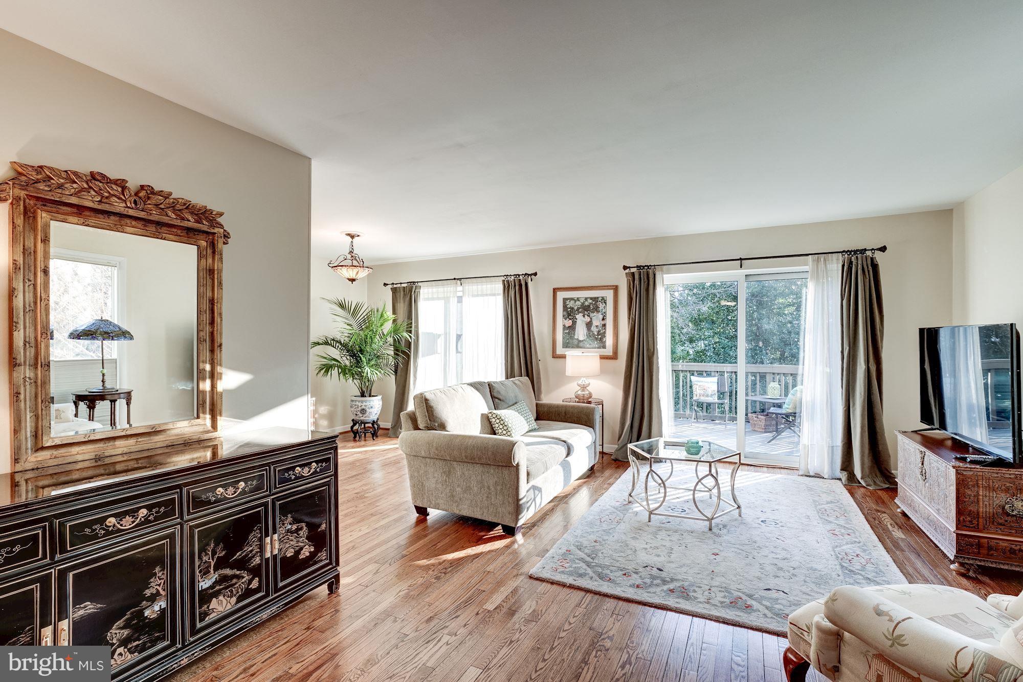 2035 Golf Course Drive Reston, VA 20191 - Photo 8 of 28 a living room with furniture and a flat screen tv