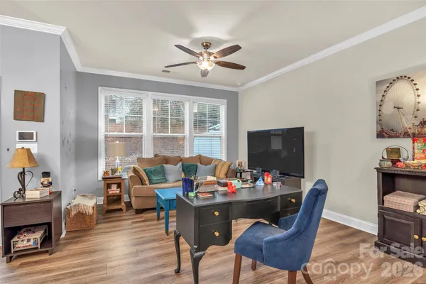 a bathroom with a sink a mirror and a window