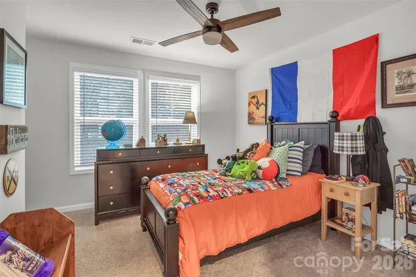 a bedroom with toys and a baby crib