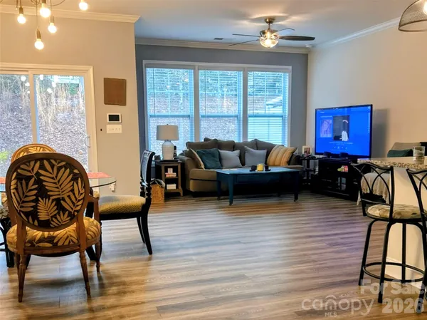 a front view of a house with a garden and yard
