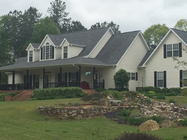 4433 Johnstonville Road Forsyth, GA 31029 - Photo 1 of 37 a front view of a house with a yard