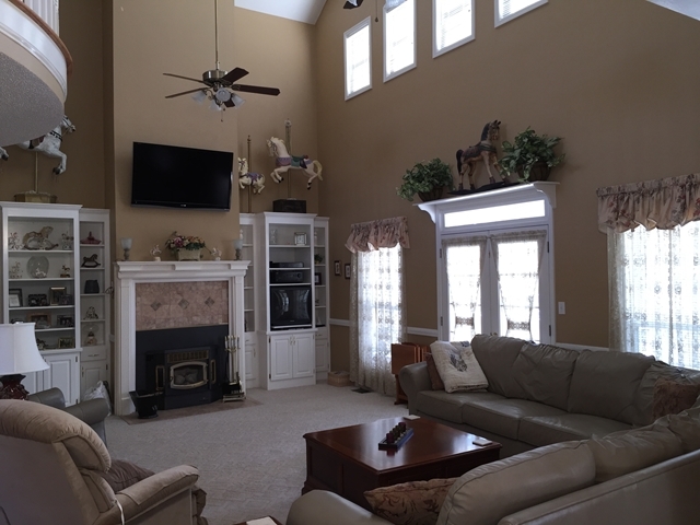 4433 Johnstonville Road Forsyth, GA 31029 - Photo 2 of 37 a living room with furniture a flat screen tv and a fireplace