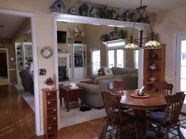 4433 Johnstonville Road Forsyth, GA 31029 - Photo 14 of 37 a view of a dining room with furniture and chandelier