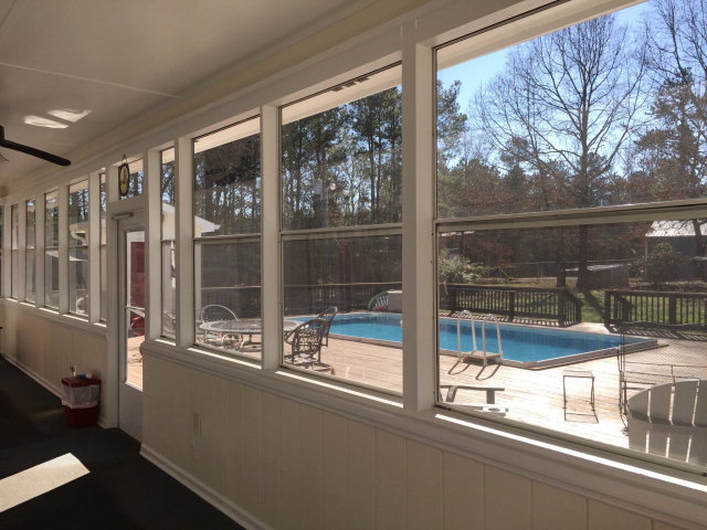 4433 Johnstonville Road Forsyth, GA 31029 - Photo 18 of 37 a view of a glass door with a tv from a window