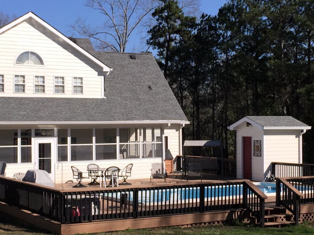 4433 Johnstonville Road Forsyth, GA 31029 - Photo 19 of 37 a front view of a house with a porch
