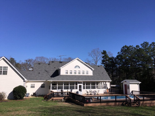 4433 Johnstonville Road Forsyth, GA 31029 - Photo 4 of 37 a front view of a house with a garden