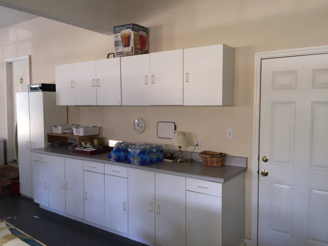 4433 Johnstonville Road Forsyth, GA 31029 - Photo 34 of 37 a kitchen with white cabinets and a sink