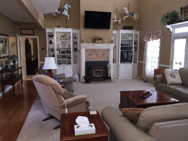 4433 Johnstonville Road Forsyth, GA 31029 - Photo 7 of 37 a living room with furniture a flat screen tv and a fireplace