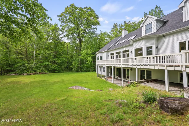 a view of entryway livingroom and hall with wooden floor