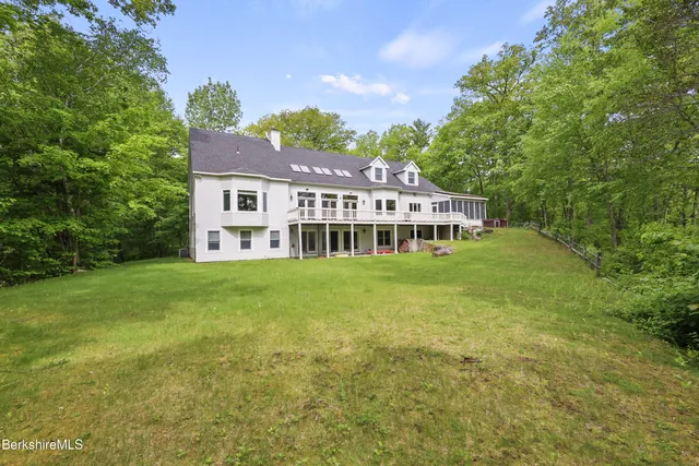 a living room with lots of furniture and a chandelier