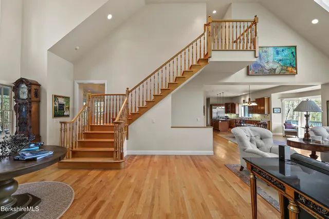 a living room with fireplace furniture and a flat screen tv