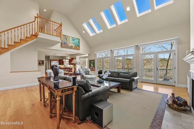 a large kitchen with a large window and stainless steel appliances