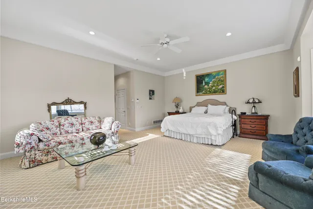 a bathroom with a granite countertop sink a shower and a mirror