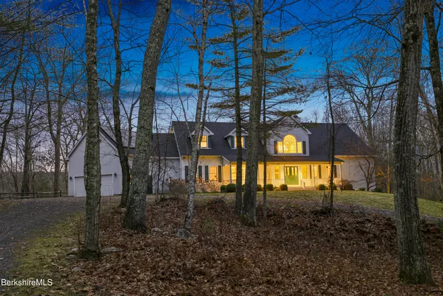 a view of a lake in middle of forest