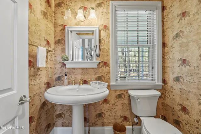 a bathroom with a sink a vanity and a mirror