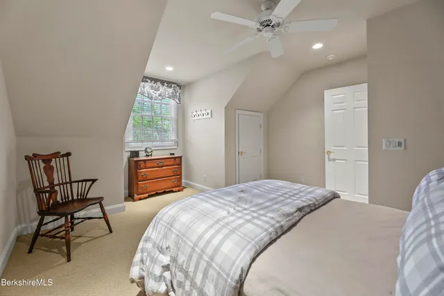 a bedroom with bed and a table