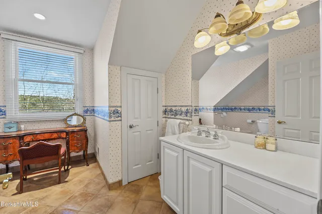 a bed room with a bed and a window