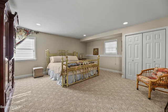 an aerial view of a house with a yard and lake view