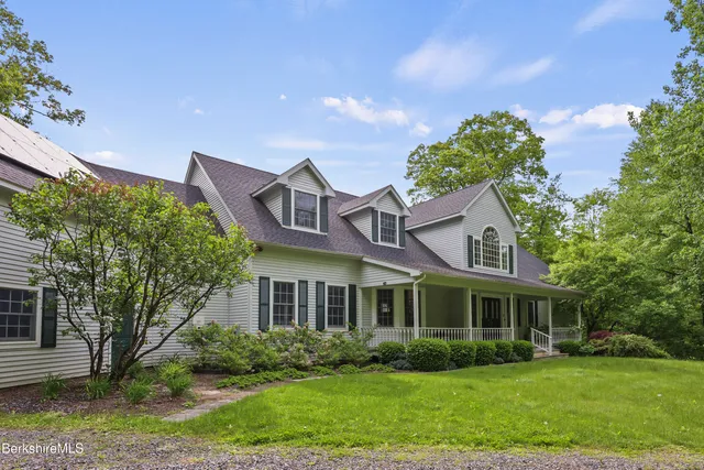 a view of house with wooden floor and windows