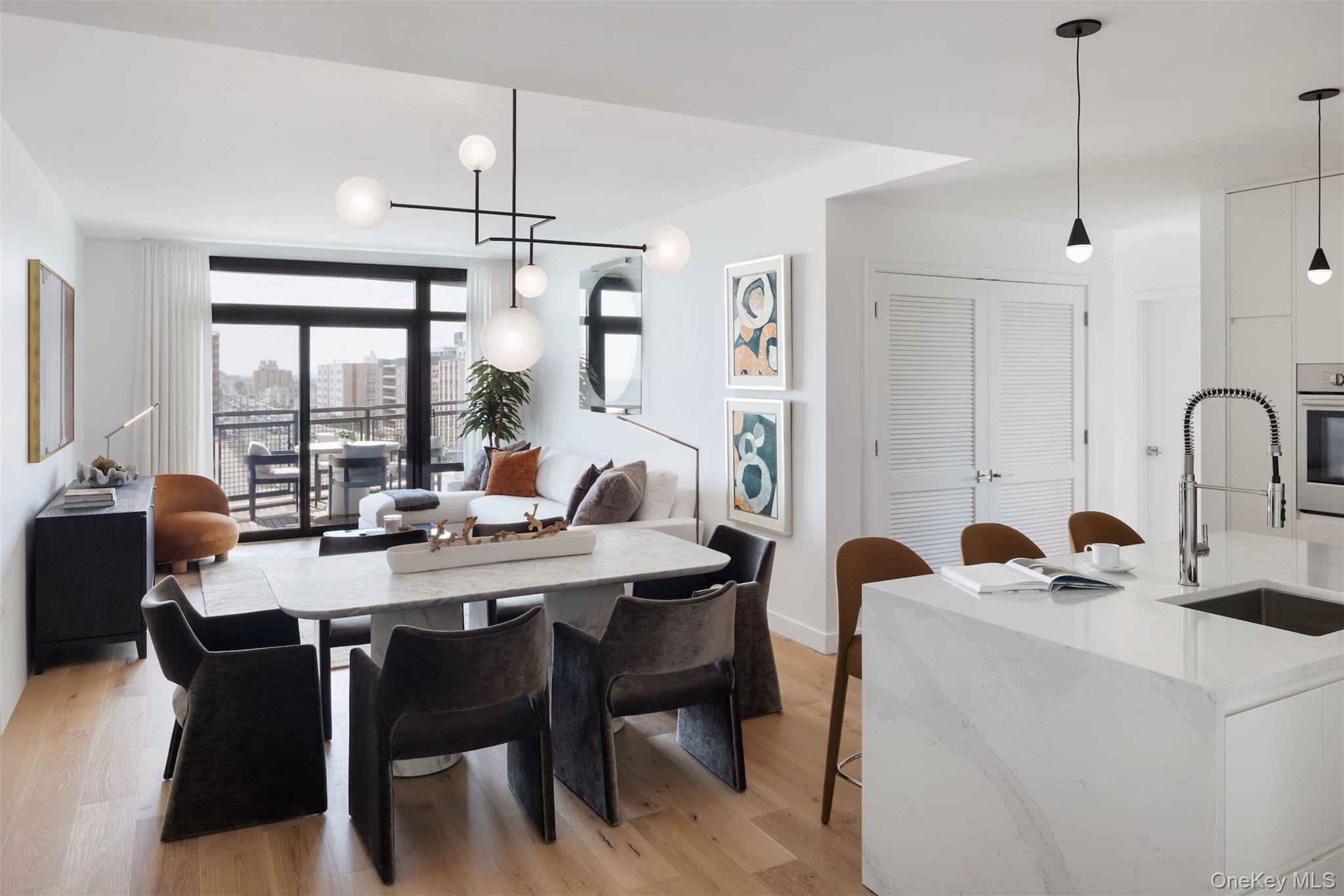 140 Boardwalk, Unit L3 B Long Beach, NY 11561 - Photo 5 of 31 a dining room with furniture a chandelier and window