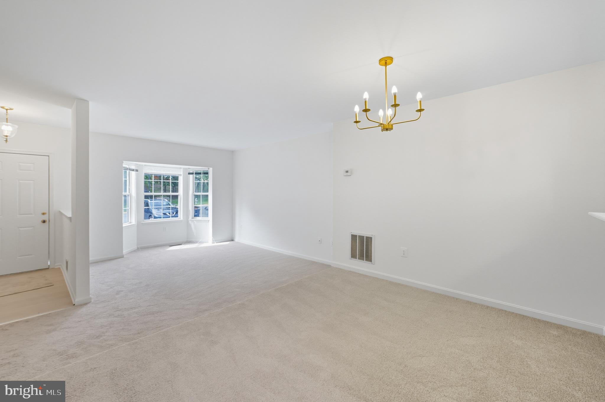2724 Hunters Gate Terrace Silver Spring, MD 20904 - Photo 12 of 46 an empty room with windows and ceiling fan