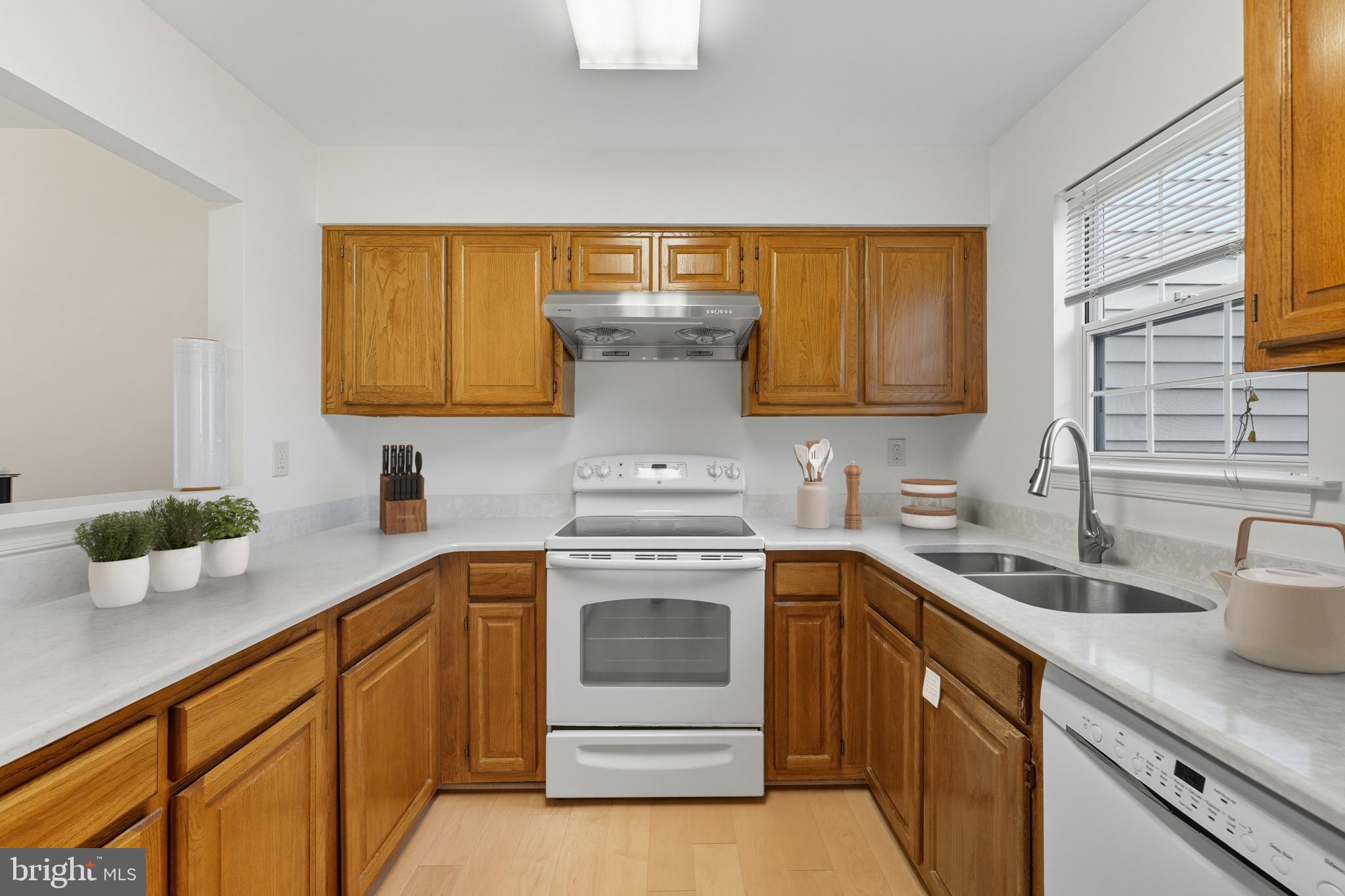 2724 Hunters Gate Terrace Silver Spring, MD 20904 - Photo 15 of 46 a kitchen with a sink and cabinets
