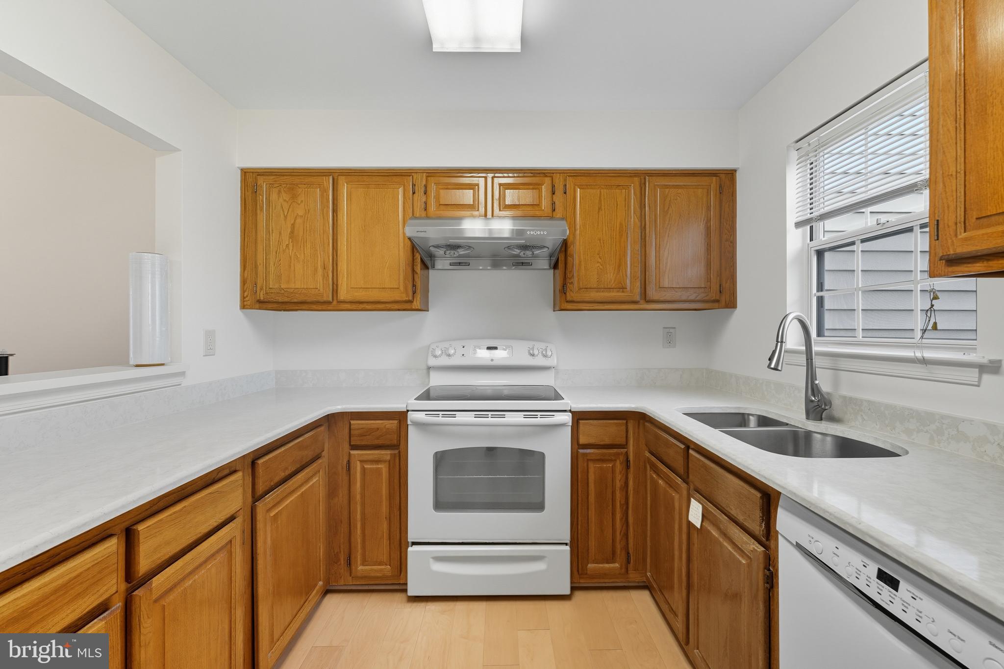 2724 Hunters Gate Terrace Silver Spring, MD 20904 - Photo 16 of 46 a kitchen with a sink and cabinets