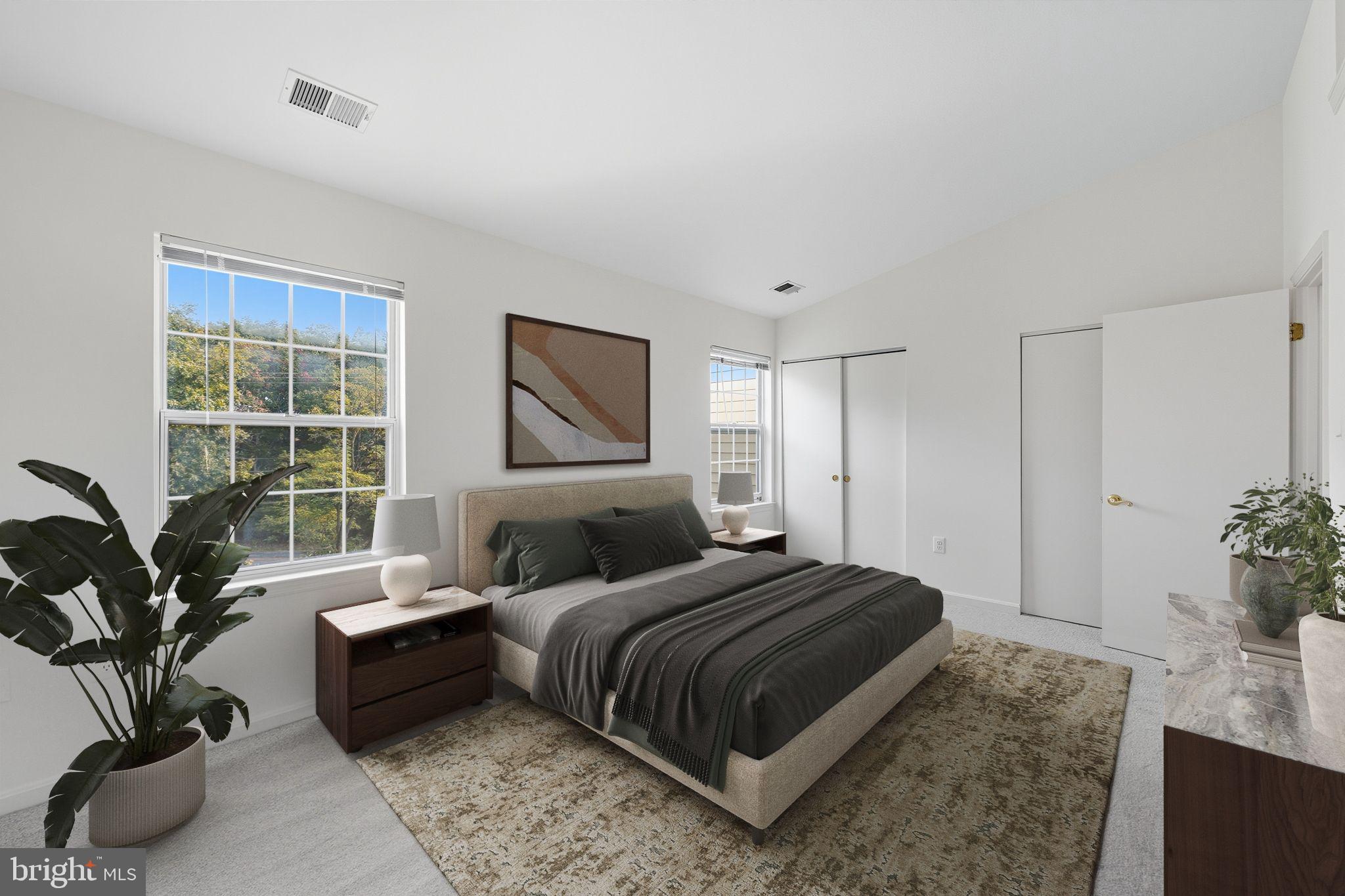 2724 Hunters Gate Terrace Silver Spring, MD 20904 - Photo 24 of 46 a bedroom with a large bed and a potted plant