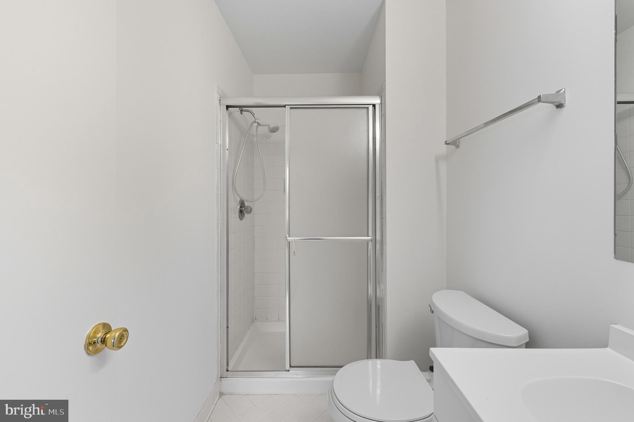 2724 Hunters Gate Terrace Silver Spring, MD 20904 - Photo 28 of 46 a white toilet sitting next to a bathroom sink