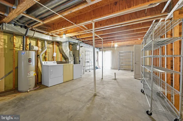 a view of an empty room with wooden walls