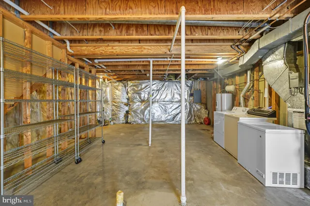 a view of a storage room with racks on the wall