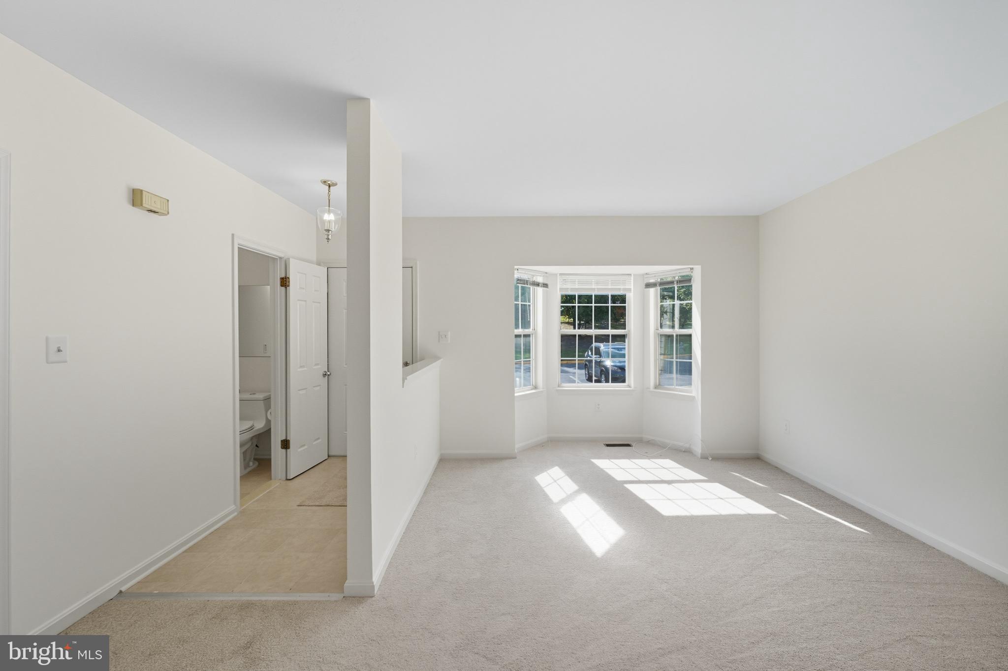 2724 Hunters Gate Terrace Silver Spring, MD 20904 - Photo 4 of 46 an empty room with windows